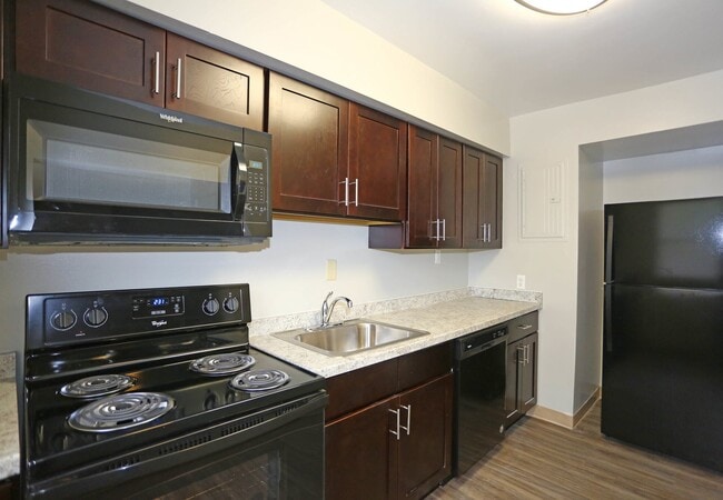 Kitchen-Semi Upgraded - Greens At Forest Park Apartments