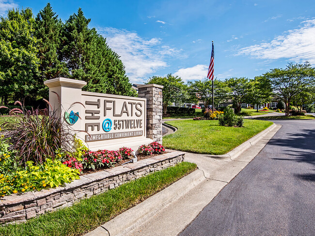 Monument Sign at Community Entrance. - The Flats at 55 Twelve Apartments