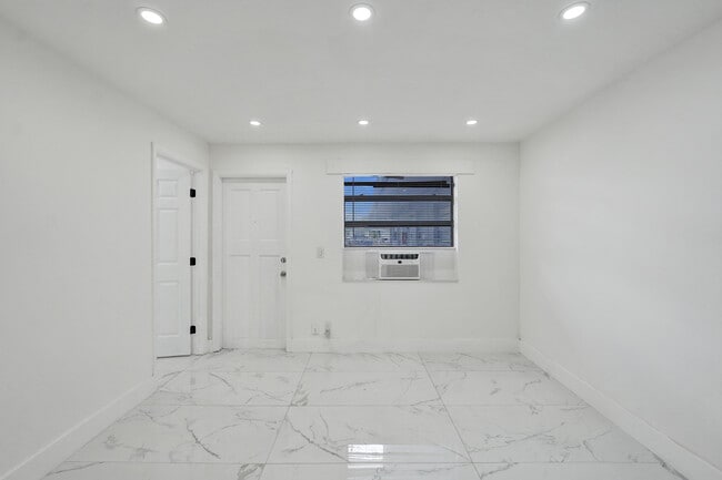 Unit 4 Living Room - MAYO GARDENS APTS