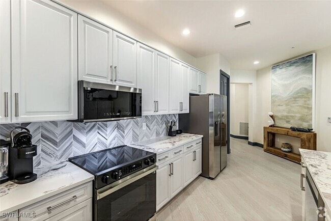 Building Photo - 5793 Cape Harbour Dr Unit 1514 Rental