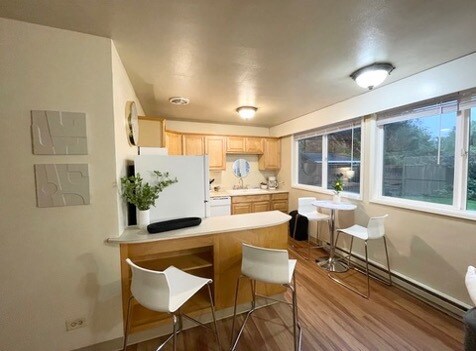 *Note* Flooring or coloring may vary slightly as the photo is of an identical downstairs unit. - 2176 W 15th Ct Unit Westmoreland Village 1