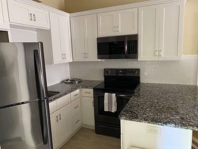 Kitchen with granite counter tops - 137 Edgecombe Rd Apartments Unit Furnished and Utilities