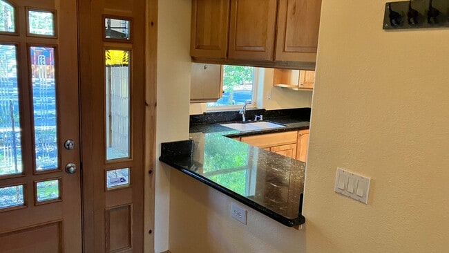 Photo - Large home with garage and fenced backyard