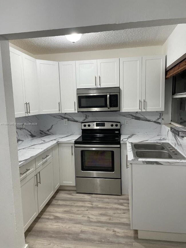 Building Photo - 5491 W 24th Ave Unit 36