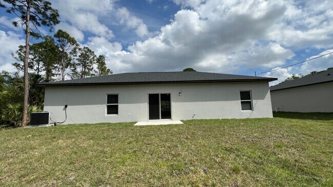 Photo - Smart & Stylish 3BD/2BA Palm Bay Home – Modern Upgrades, No Water Bills!