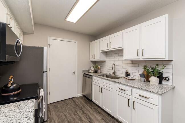Kitchen with granite counters and modern cabinetry