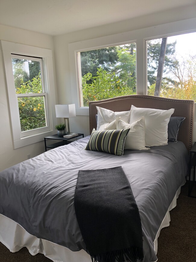 Bedroom one, with view of the garden - 1105 High Ct Apartments Unit B