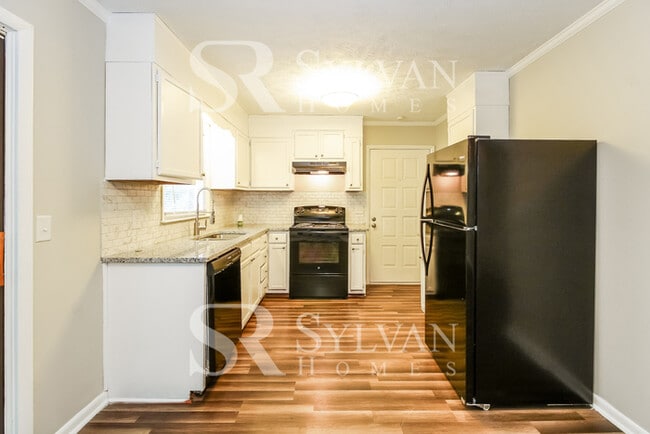 Photo - Enjoy living the good life in this 4 BR, 3 BA brick rancher