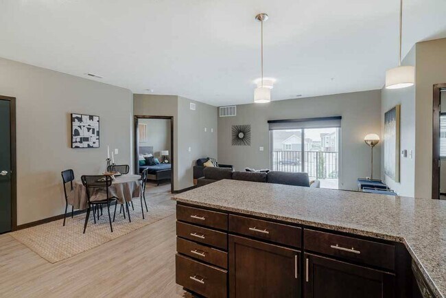 Entertaining is made easy in the 2-bed Magnolia featuring a large peninsula granite countertop.