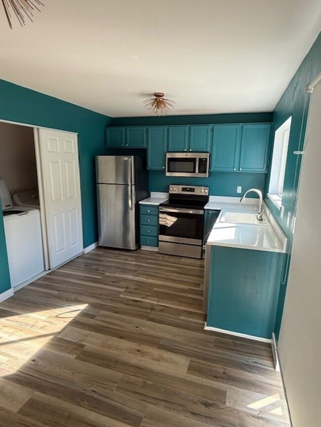 Photo - Updated duplex on quiet street. Large yard, all appliances.