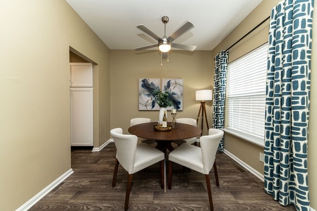 Dining area with hardwood-style flooring
