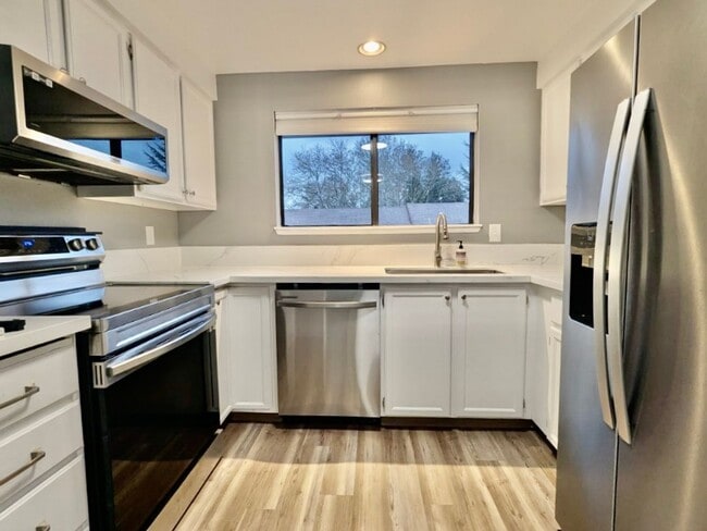 Photo - Stunning 2 Bedroom Condo with Fireplace, Modern Upgrades and Air Conditioning!