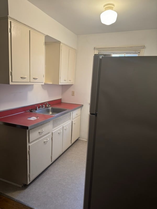 Kitchen, stove is behind the fridge. - 3097 Riddle View Ln Unit D
