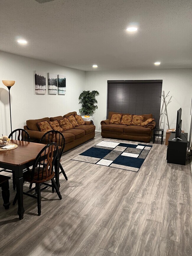 Living area (Couches and dining table) - 4837 Cedar Springs Rd Unit 320