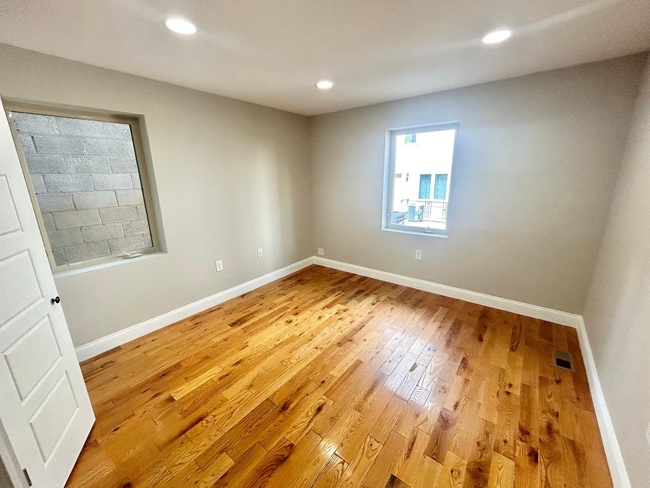 Photo - Spacious 3-Bedroom, 2-Bath Apartment with Finished Basement, Private Patio, and In-Unit Laundry