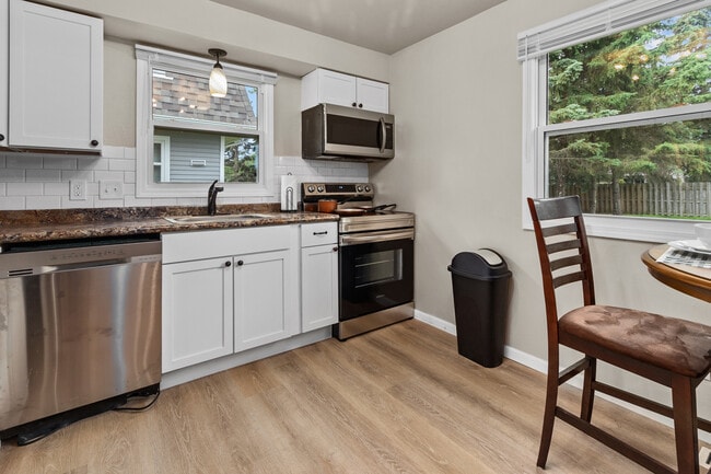 Kitchen with full size stainless steel applicances - 2701 N Helen St