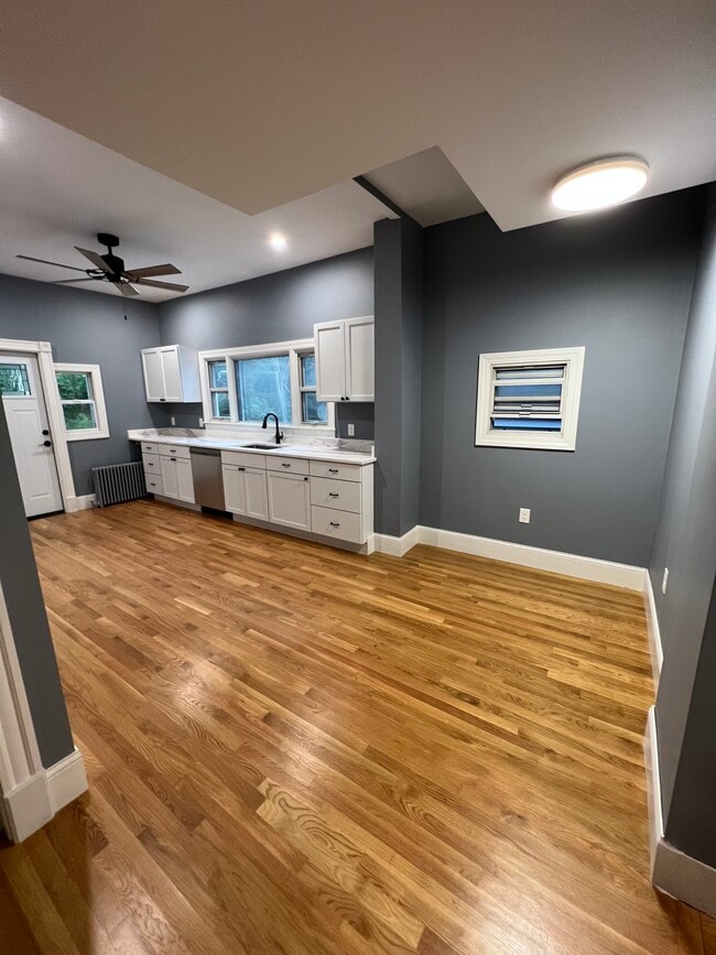 Eat-in kitchen with granite countertops and stainless steel appliances - 111 Falcon St Unit 2