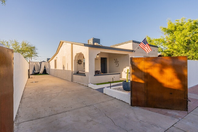Front gated parking - 227 E 24th St House