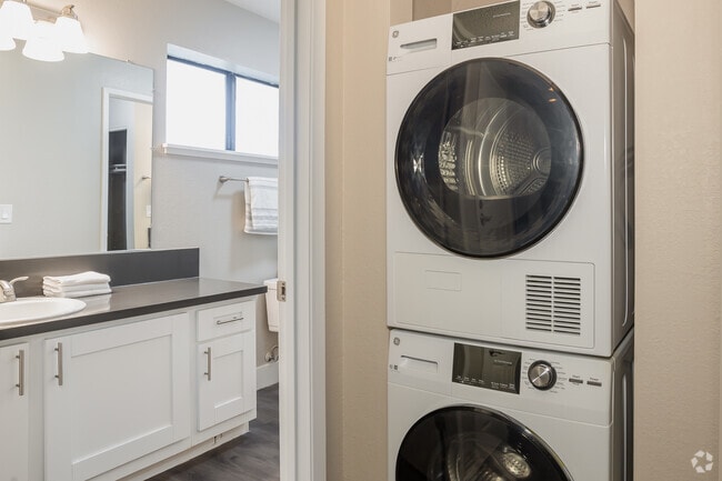 1BR, 1BA - 688SF Laundry/ Bathroom - Ellington Apartments