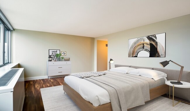 Spacious bedrooms feature large windows, Karndean wood plank flooring and large closets