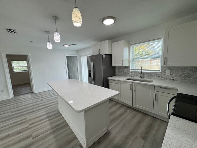 Photo - Recently Renovated 4/2 Home with Open Layout & Huge Backyard