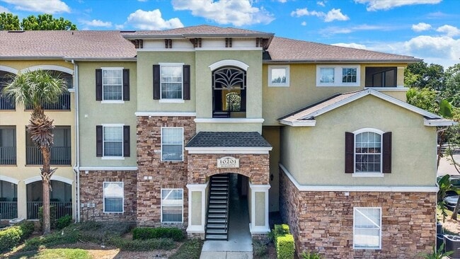 Building Photo - 10201 Courtney Palms Blvd Unit 304