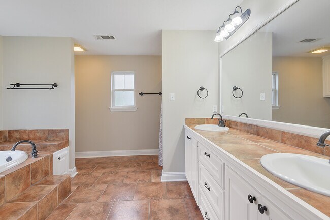master bath with separate shower and tub - 14062 Bourque Rd