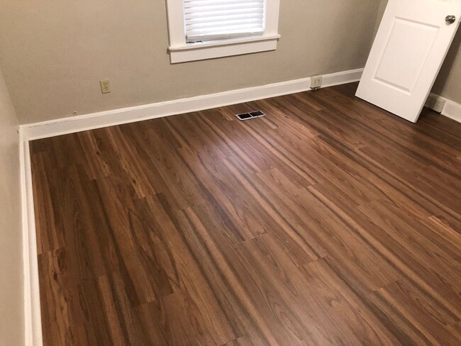 Building Photo - Freshly Painted 2x1 with Brand-New Plank F...