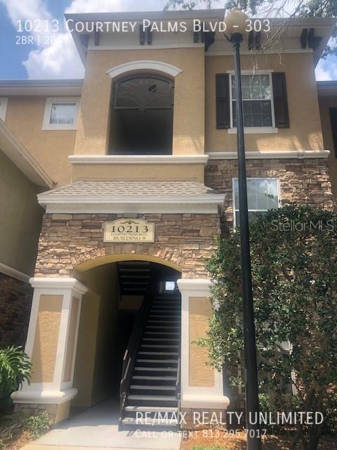 Building Photo - 10213 Courtney Palms Blvd Unit 303