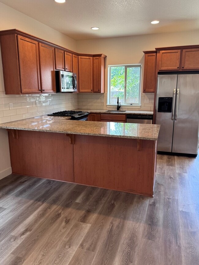 Photo - Beautiful Home with LVP Flooring, SS Appliances, Garage, W/D, Fenced Yard, LARGE Master & MORE!