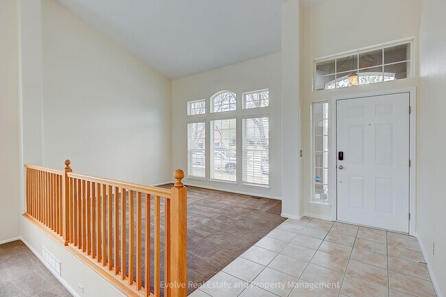 Photo - Evolve Real Estate: Spacious 4-Bedroom Home with Finished Basement & 3-Car Garage in Thornton- Av...