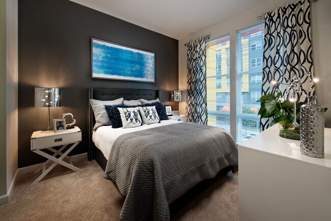 Bedroom with carpet and accent wall