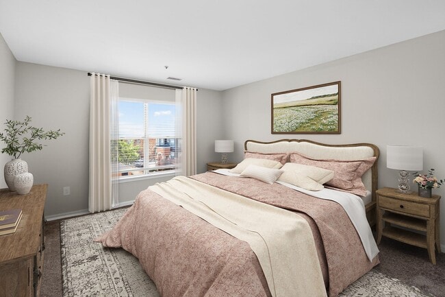 Elevate your living at Eagle Rock Apartments at Columbia Pike. This beautifully designed bedroom offers a serene retreat with stunning views. Enjoy modern amenities and a vibrant community. Schedule your tour today to find your perfect home! - Eagle Rock Apartments at Columbia Pike