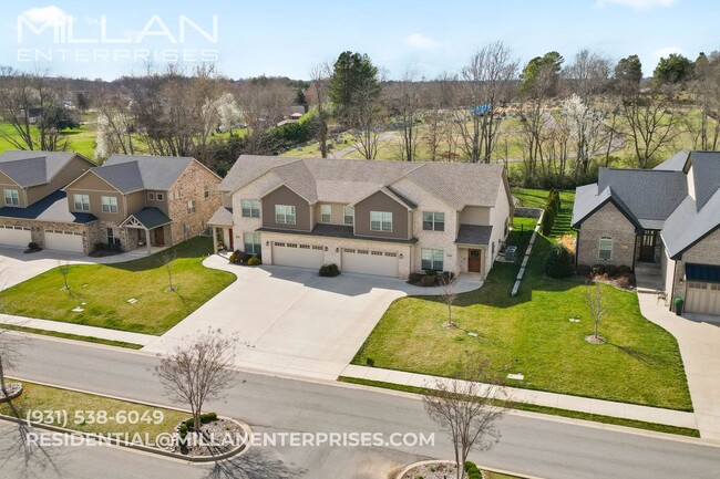 Photo - Luxury Living at Its Finest In Sango Featuring An Open Floor Plan, Fireplace and Resort Style Pri...