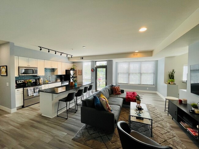 Open concept living room, kitchen, dining area, etc - 4500 Chicago Ave Condo Unit 303