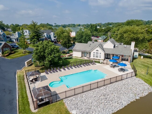 Soak up the sun in our sparkling pool area, surrounded by tall trees and comfy lounge chairs.