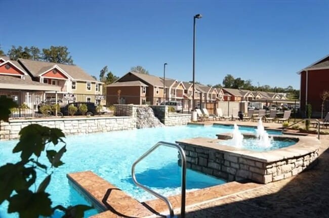 Relax by the inviting pool at Bee Creek, complete with tranquil waterfalls and comfortable lounge areas. Perfectly designed for leisure and enjoyment, this oasis awaits your visit. Schedule your tour today to see it for yourself!