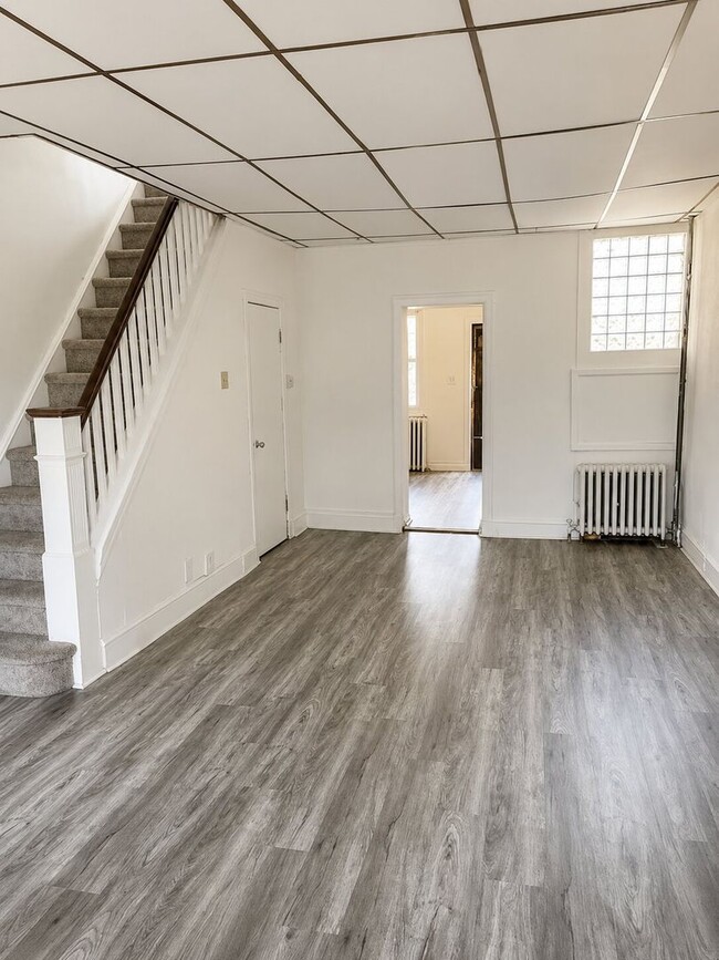 Photo - Bright 2BR Port Richmond Row Home with Large Living Space & Basement Storage