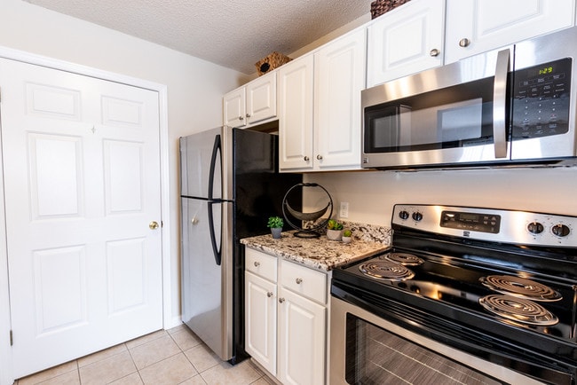 Kitchen with Must-Have Granite Countertops & Stainless Steel Appliances