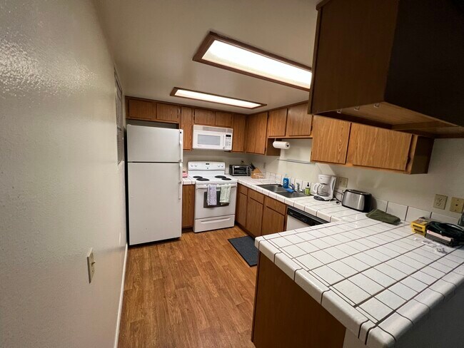 Very functional kitchen. Coffee Maker, toaster oven, electric range/oven, panini press etc.