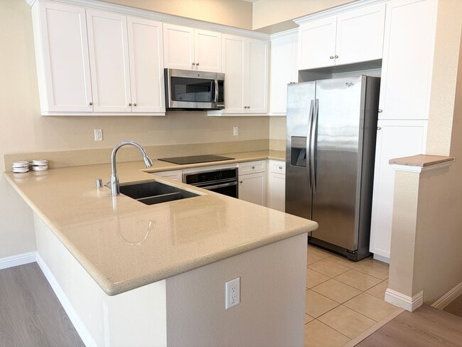 Photo - Stylish 3-Story Townhome with Balcony & Open-Concept Living