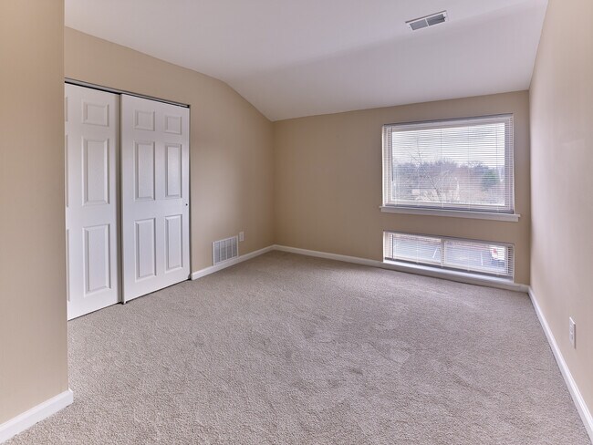 Bright bedroom with oversized window and spacious double closets in this 2 Bed, 1 Bath, 908 sq. ft. home.