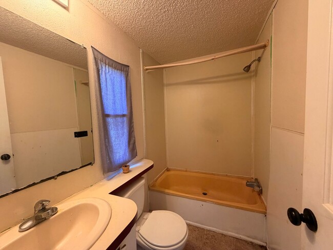 Photo - This 3-bedroom, 2-bathroom home on the outskirts of Russellville, AR