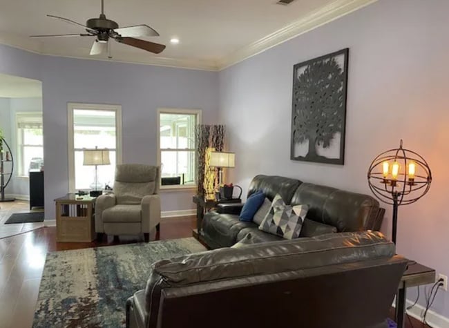 Photo - Stylish 3BR Home with Open Layout, Screened Porch & Fenced Yard