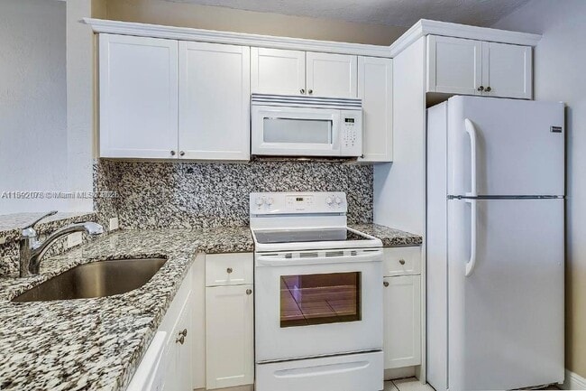 Building Photo - 8305 SW 72nd Ave Unit 102A