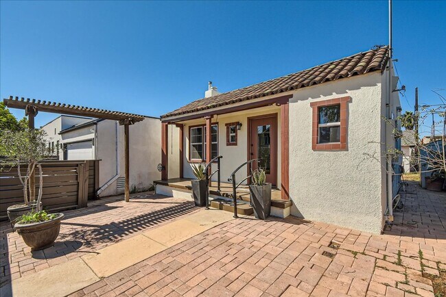 Photo - **Charming Spanish-Style Bungalow in Vibra...