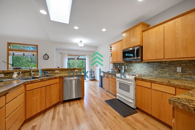 Photo - "Spacious 4-Bedroom Retreat with 4.5 Baths in Scenic Snohomish - Your 4400 Sq Ft Haven Awaits!"