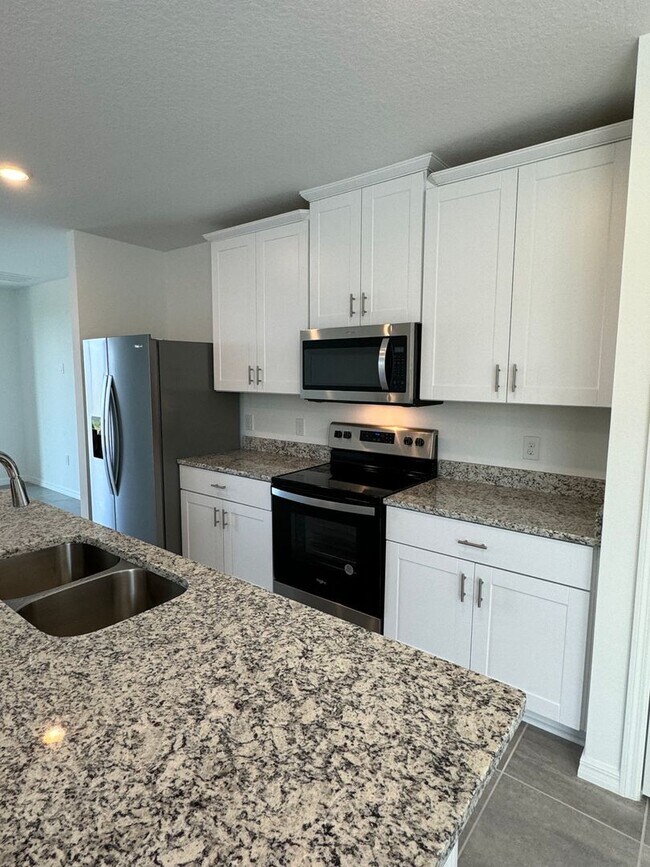 Photo - 3 Bedroom 2 Bath with Double Car Garage in Poinciana!