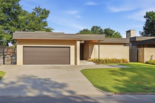 Building Photo - Experience contemporary luxury in this exceptional custom-built Midtown Tulsa residence, where so...