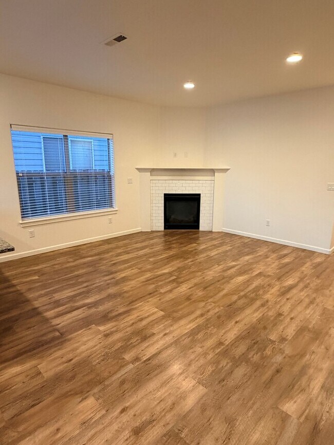 Beautiful Home w/Gas Fireplace, Plank Flooring, Fenced Yard, Garage, W/D & MORE!